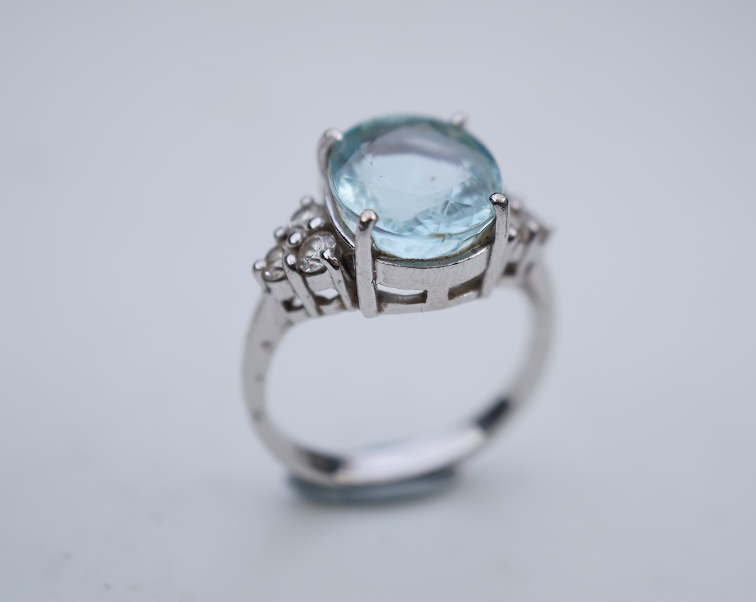 An aquamarine and diamond ring